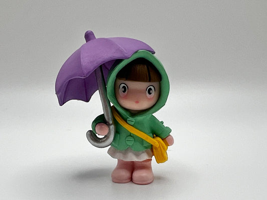 Figura de paraguas morado