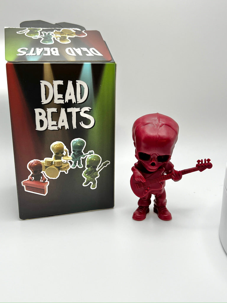 Dead Beats Bass Player (Red) by Cardboard Spaceship